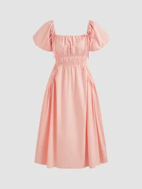  Robe mi-longue en coton uni froncé à ourlet bouffant noué